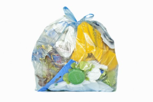 Van parked outside a Thamesmead commercial block ready for waste removal